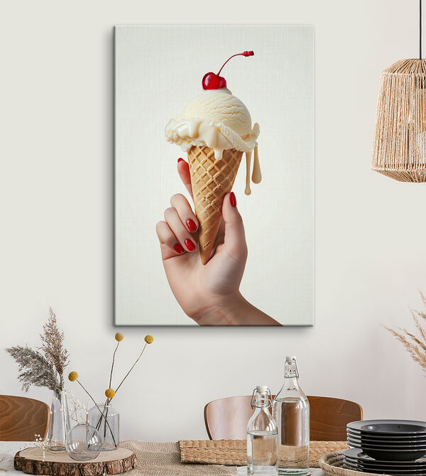 Hand holding an ice cream cone with a cherry on top Hand holding an ice cream cone with a cherry on top