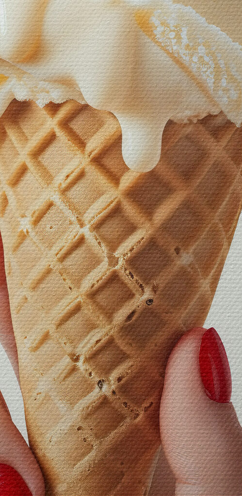 Hand holding an ice cream cone with a cherry on top Hand holding an ice cream cone with a cherry on top