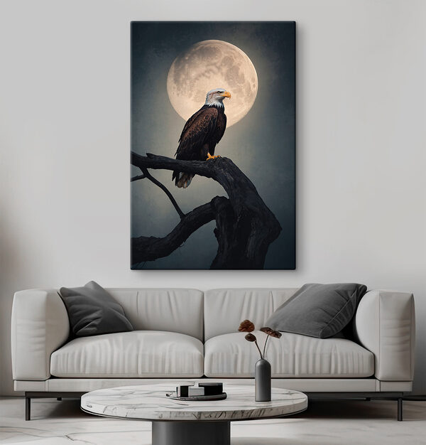 Bald eagle on a branch with a full moon in the background Bald eagle on a branch with a full moon in the background