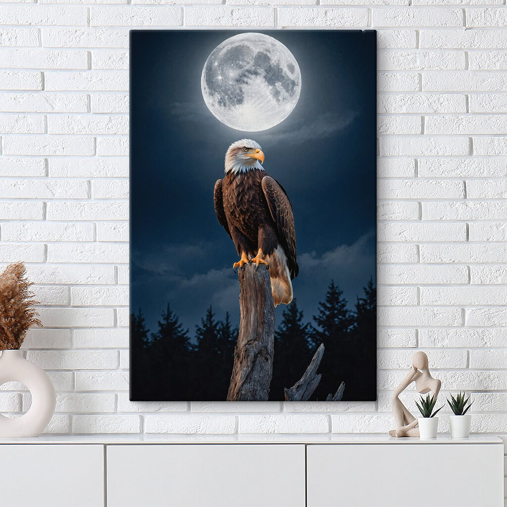 Bald eagle on a post with a full moon in the background Bald eagle on a post with a full moon in the background