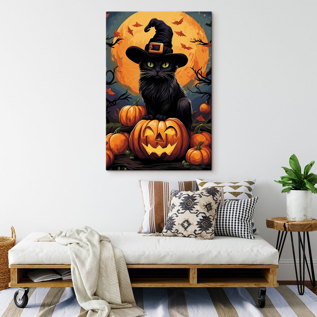 Cat wearing a hat and sitting on a pumpkin Cat wearing a hat and sitting on a pumpkin