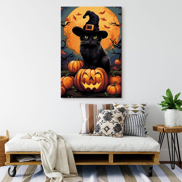Cat wearing a hat and sitting on a pumpkin Cat wearing a hat and sitting on a pumpkin