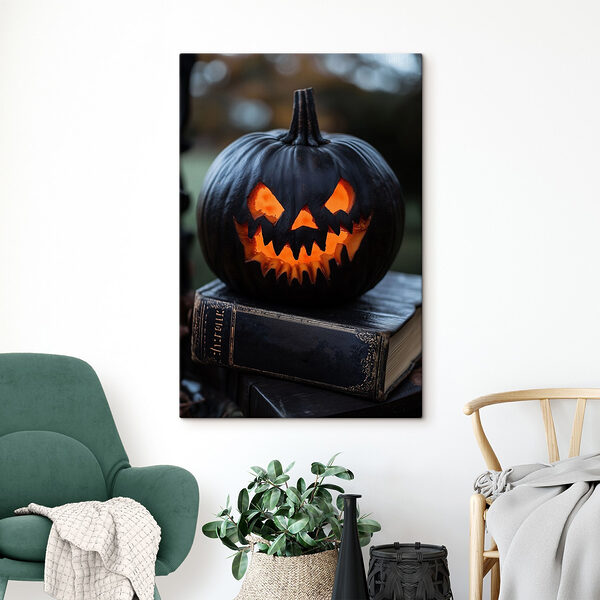 Carved pumpkin on a book