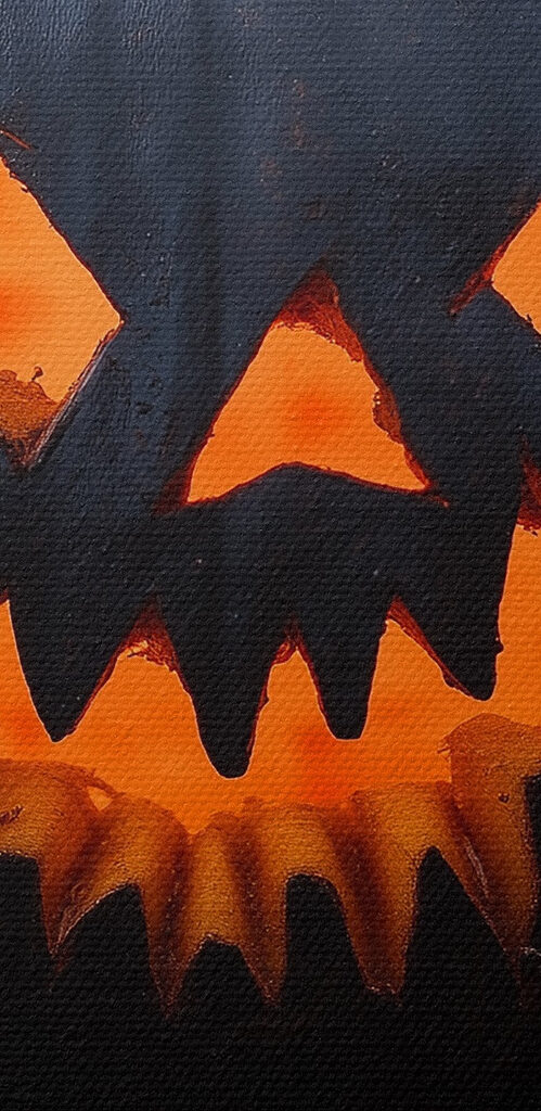 Carved pumpkin on a book