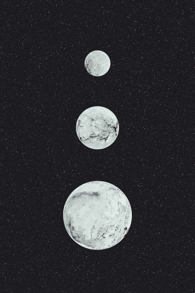 Group of white planets in a row Group of white planets in a row