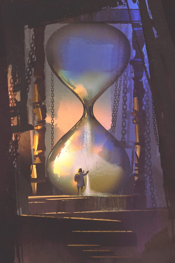 Person standing in a large hourglass
