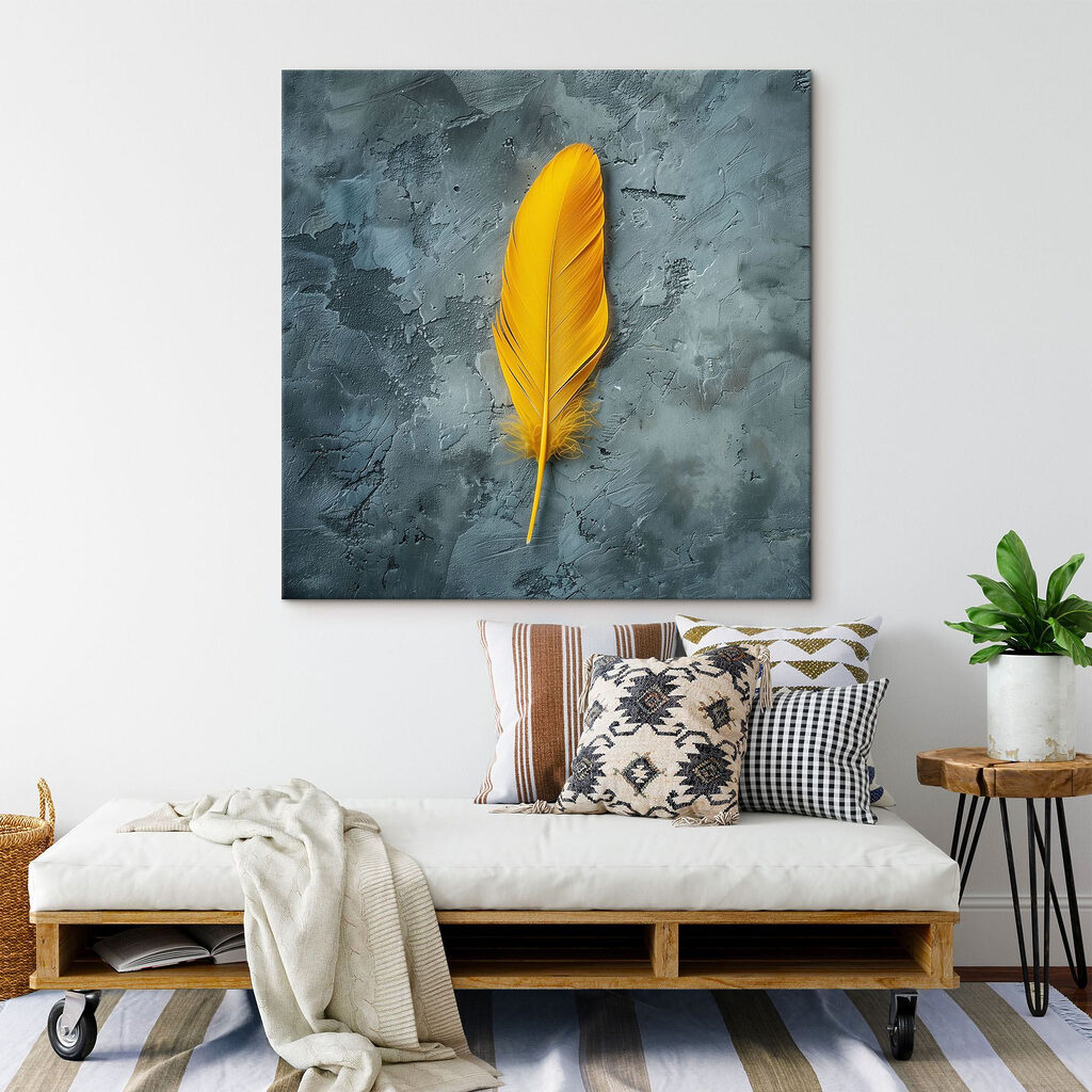 Yellow feather on a grey surface