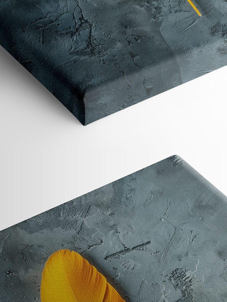 Yellow feather on a grey surface