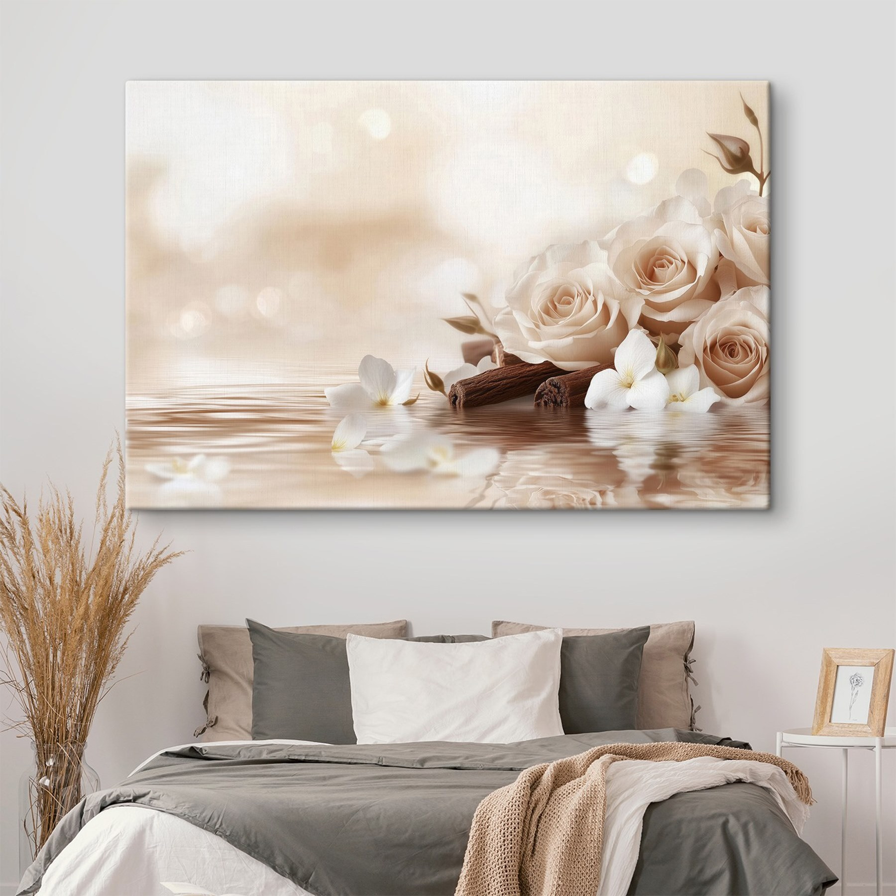 Group of white roses and cinnamon sticks in water