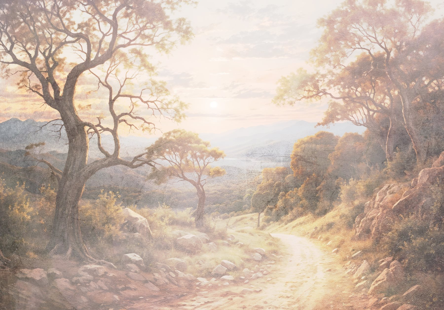 Dirt road with trees and mountains in the background