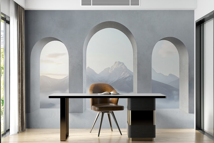 Habitación blanca con ventanas arqueadas y montañas al fondo