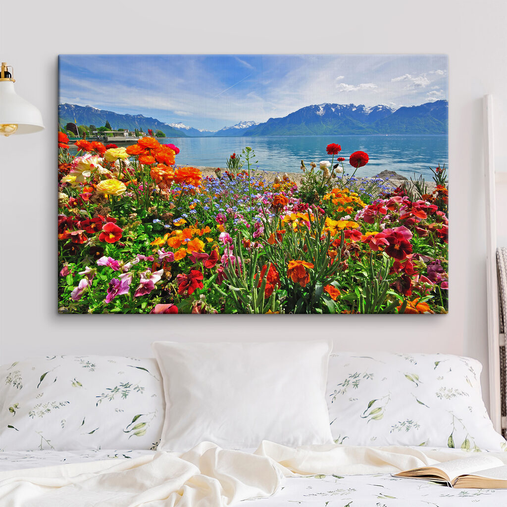 Flower bed with flowers and a lake in the background