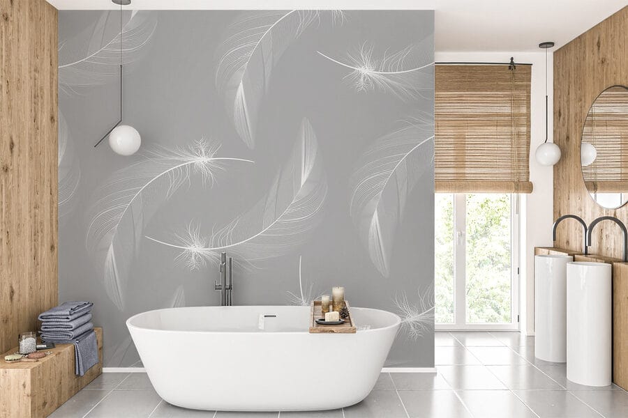 Plumas blancas sobre fondo gris