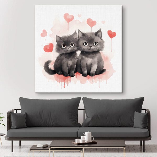 Two cats sitting next to each other