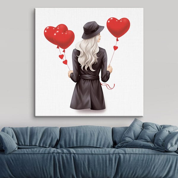 Woman holding a heart shaped balloon Woman holding a heart shaped balloon