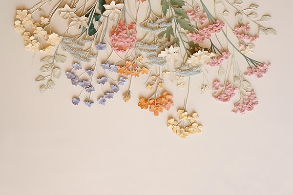 Group of flowers on a white surface