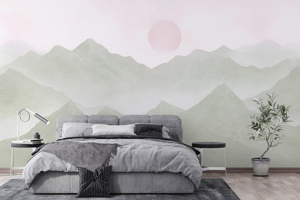 Mountain range with a sun in the distance