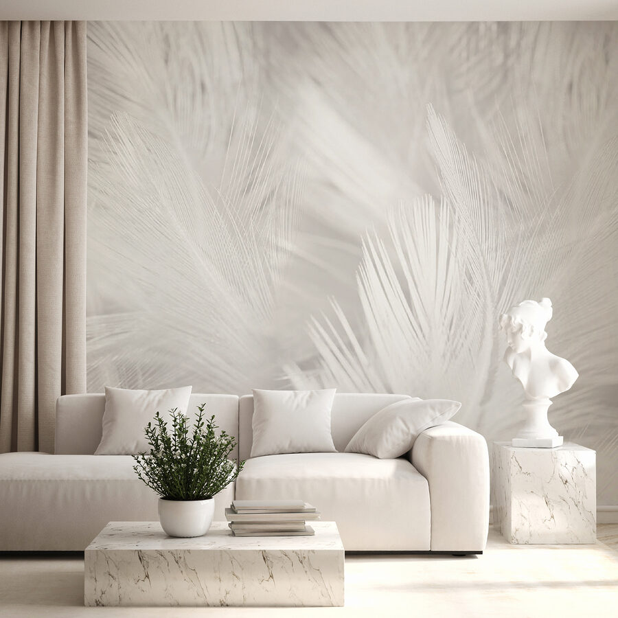 Plumas blancas sobre una superficie blanca