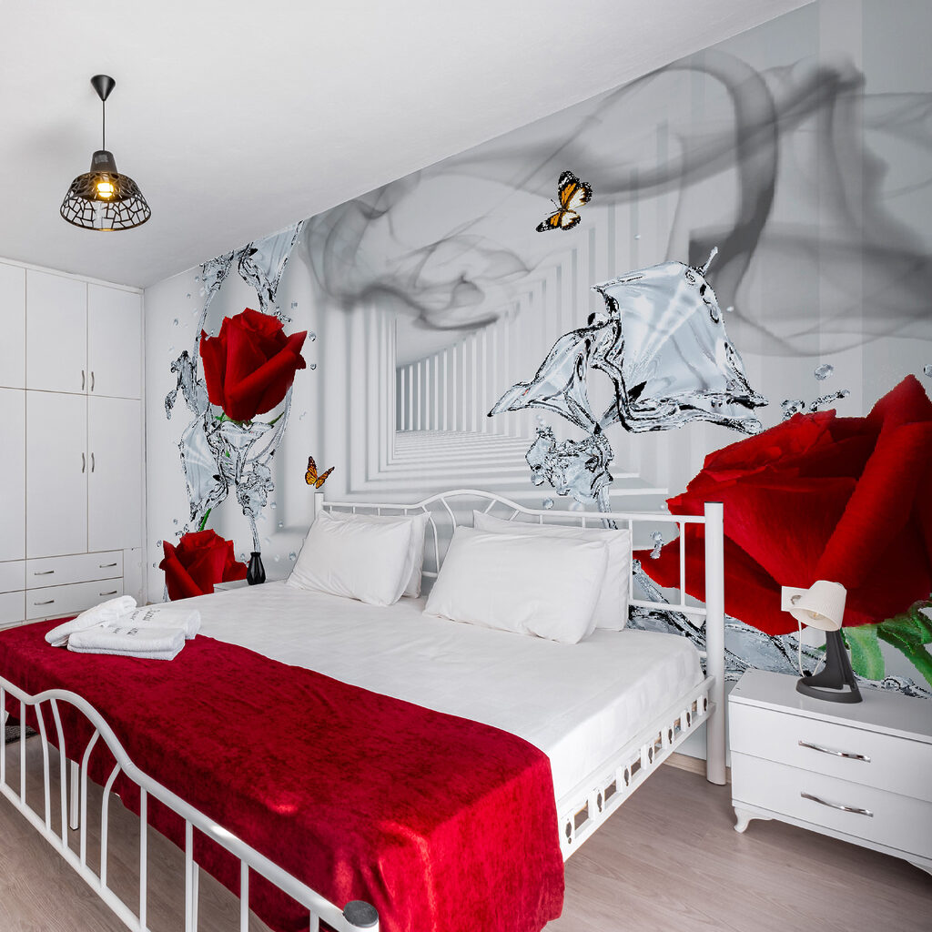 Red roses and butterflies in a glass Red roses and butterflies in a glass