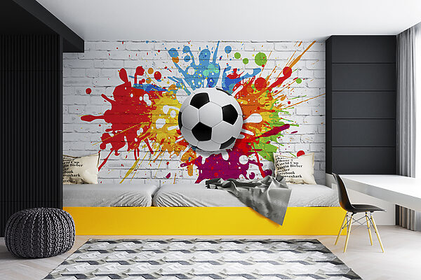 Balón de fútbol en una pared de ladrillos Balón de fútbol en una pared de ladrillos