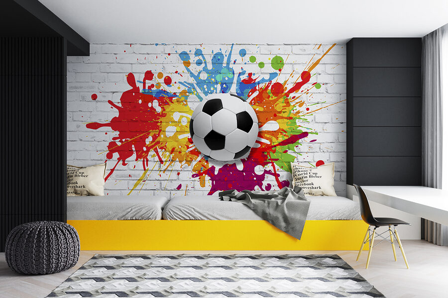 Balón de fútbol en una pared de ladrillos Balón de fútbol en una pared de ladrillos