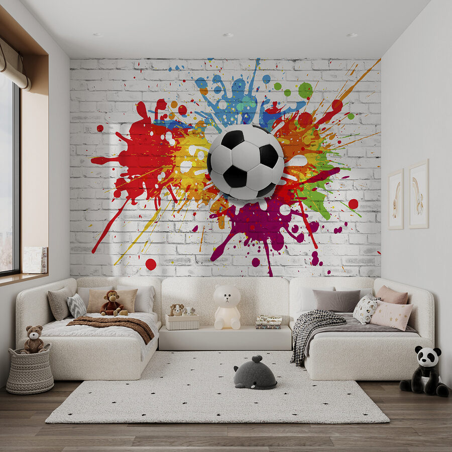 Balón de fútbol en una pared de ladrillos Balón de fútbol en una pared de ladrillos