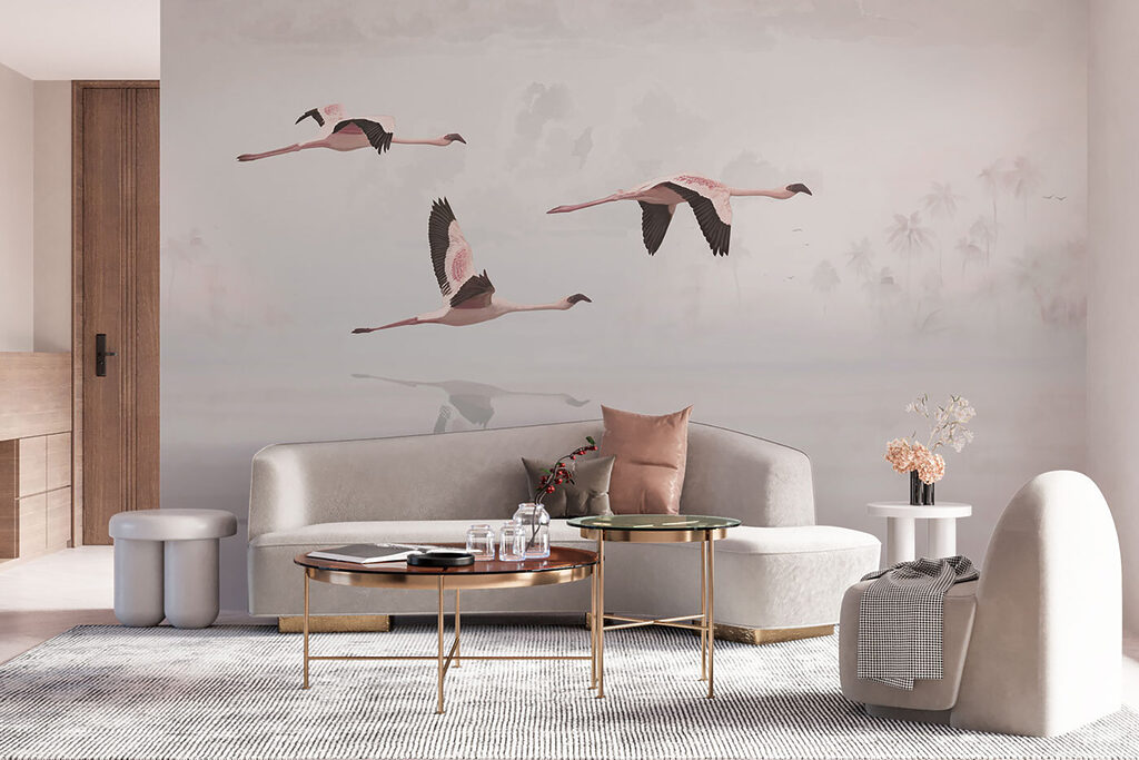 A group of flamingos flying over water A group of flamingos flying over water