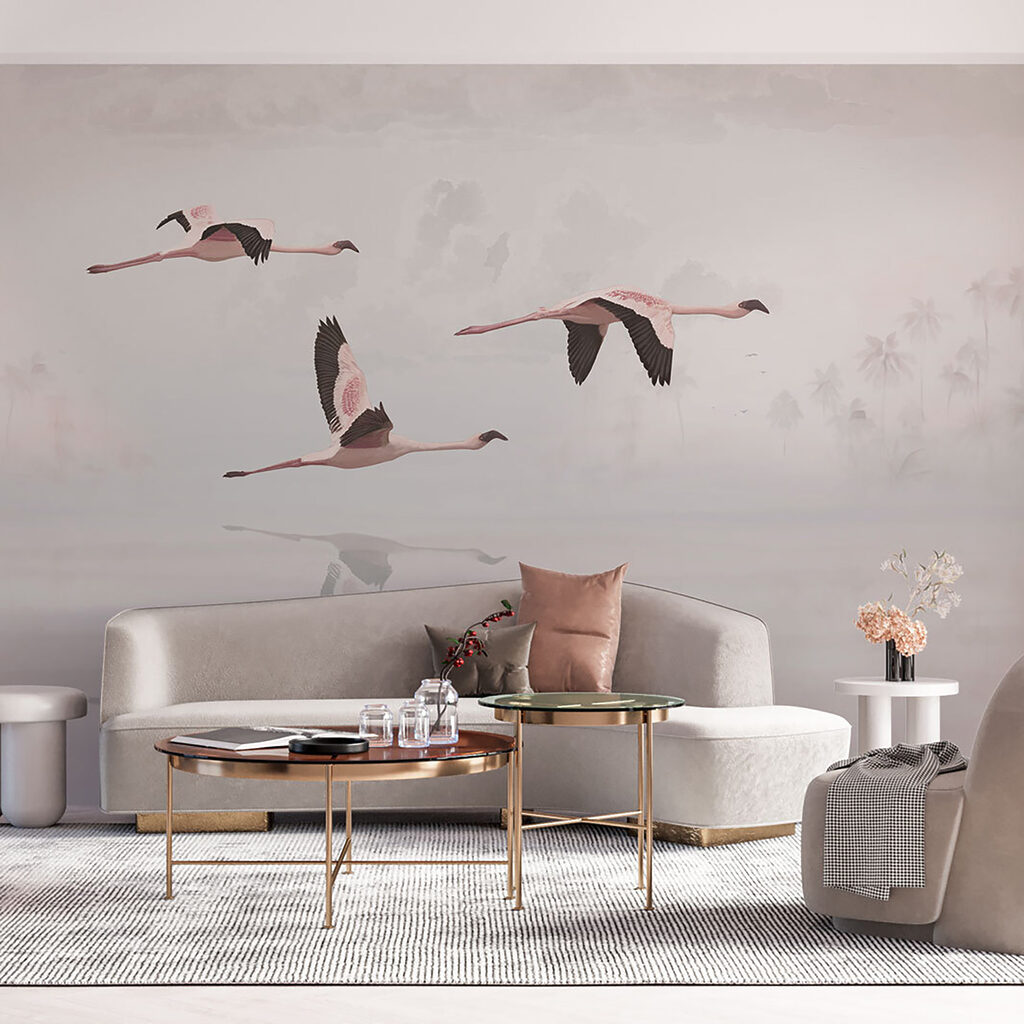 A group of flamingos flying over water A group of flamingos flying over water