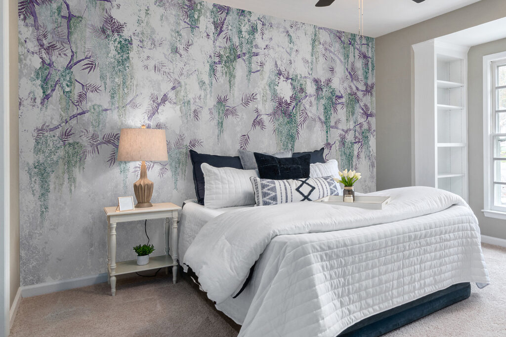 A tree branch with purple flowers