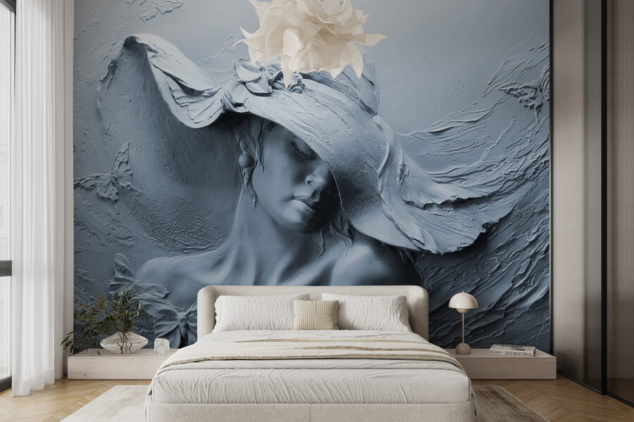 Escultura de una mujer con sombrero