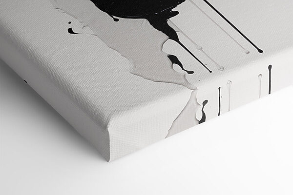 Black and white paint splattered on a white surface Black and white paint splattered on a white surface