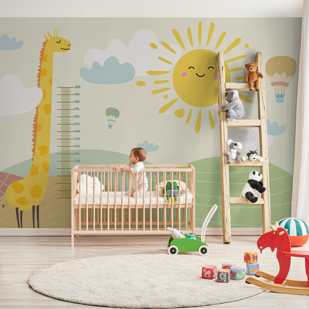 A giraffe standing in a field with a sun and clouds