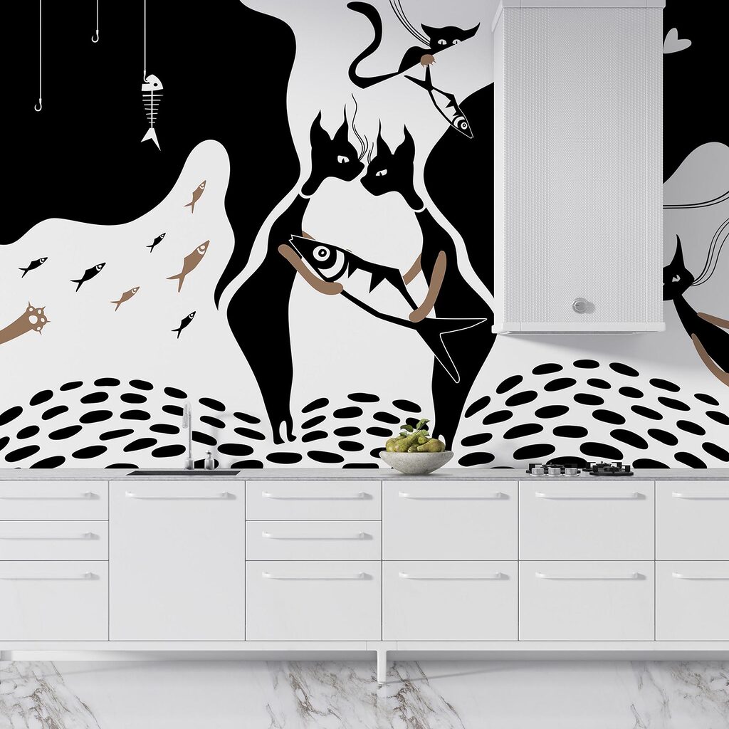 Gato blanco y negro con pez y pez