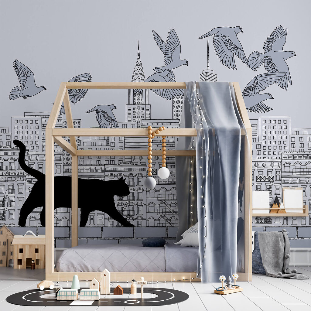 Gato caminando sobre una pared con pájaros volando en el cielo Gato caminando sobre una pared con pájaros volando en el cielo