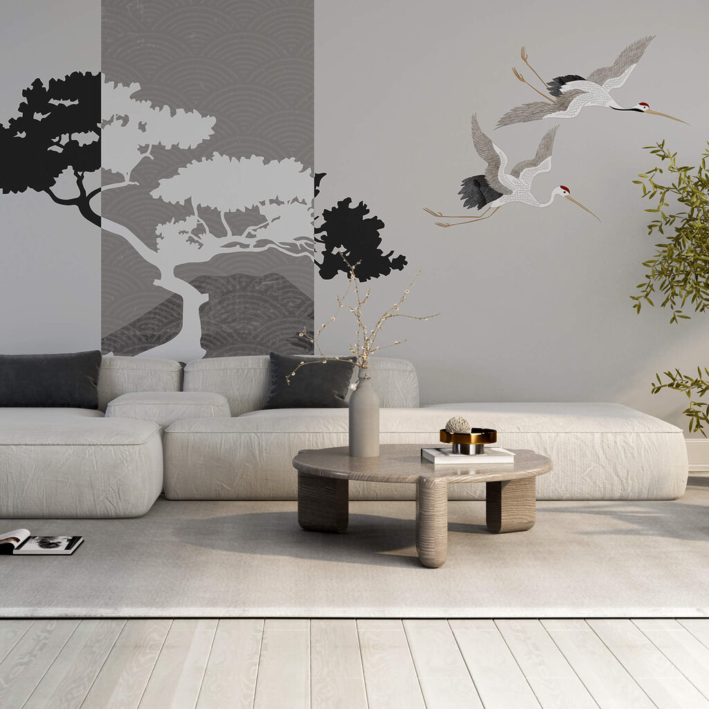 Pareja de grullas volando junto a un árbol