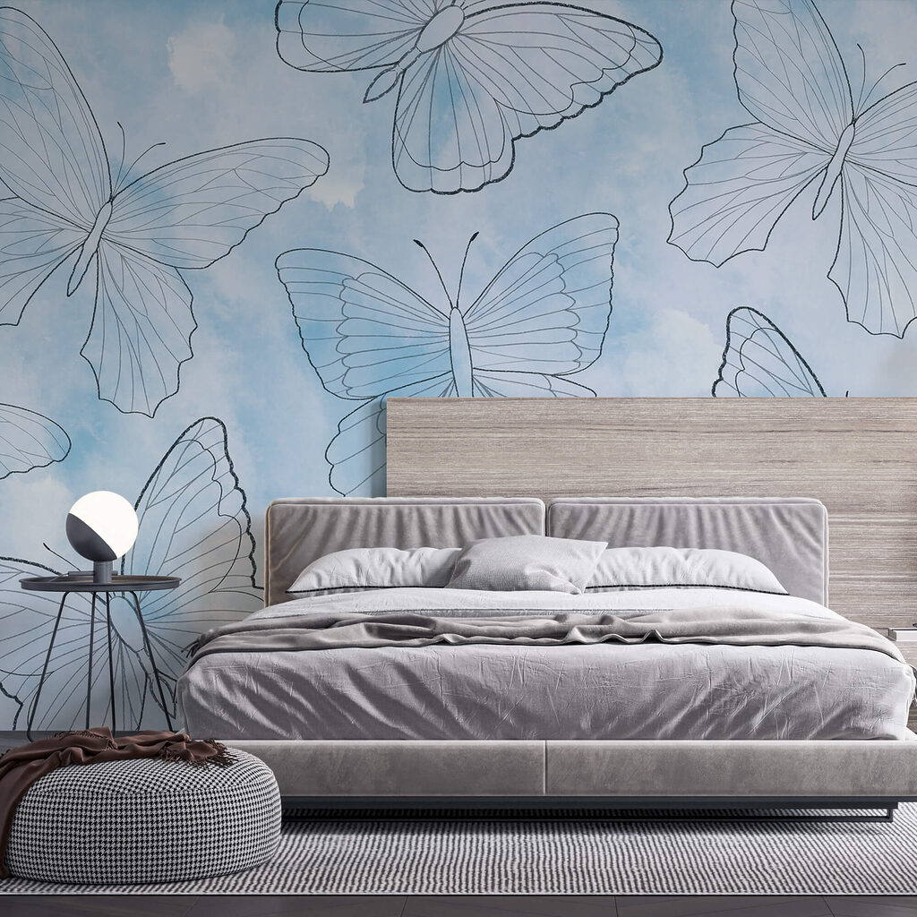 Patrón de mariposas sobre fondo azul