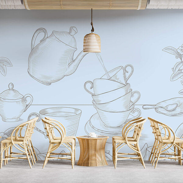 Tetera vertiendo en una pila de tazas de té