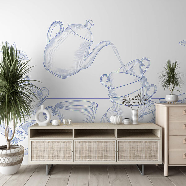 Tetera vertiendo en una pila de tazas de té Tetera vertiendo en una pila de tazas de té