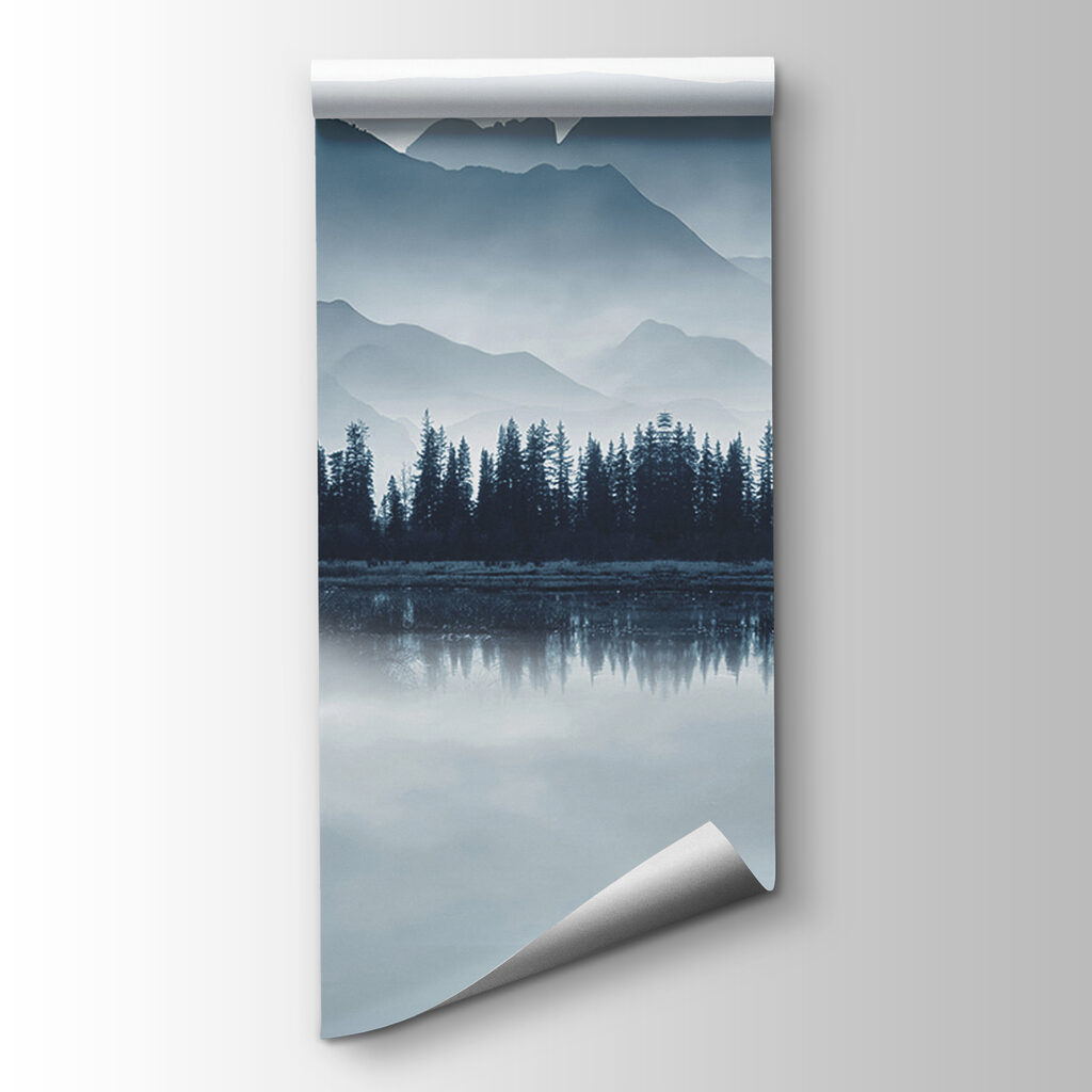 Person in a boat on a lake with mountains in the background Person in a boat on a lake with mountains in the background