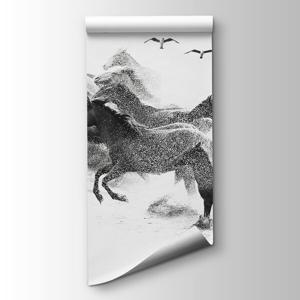 A group of horses running through water