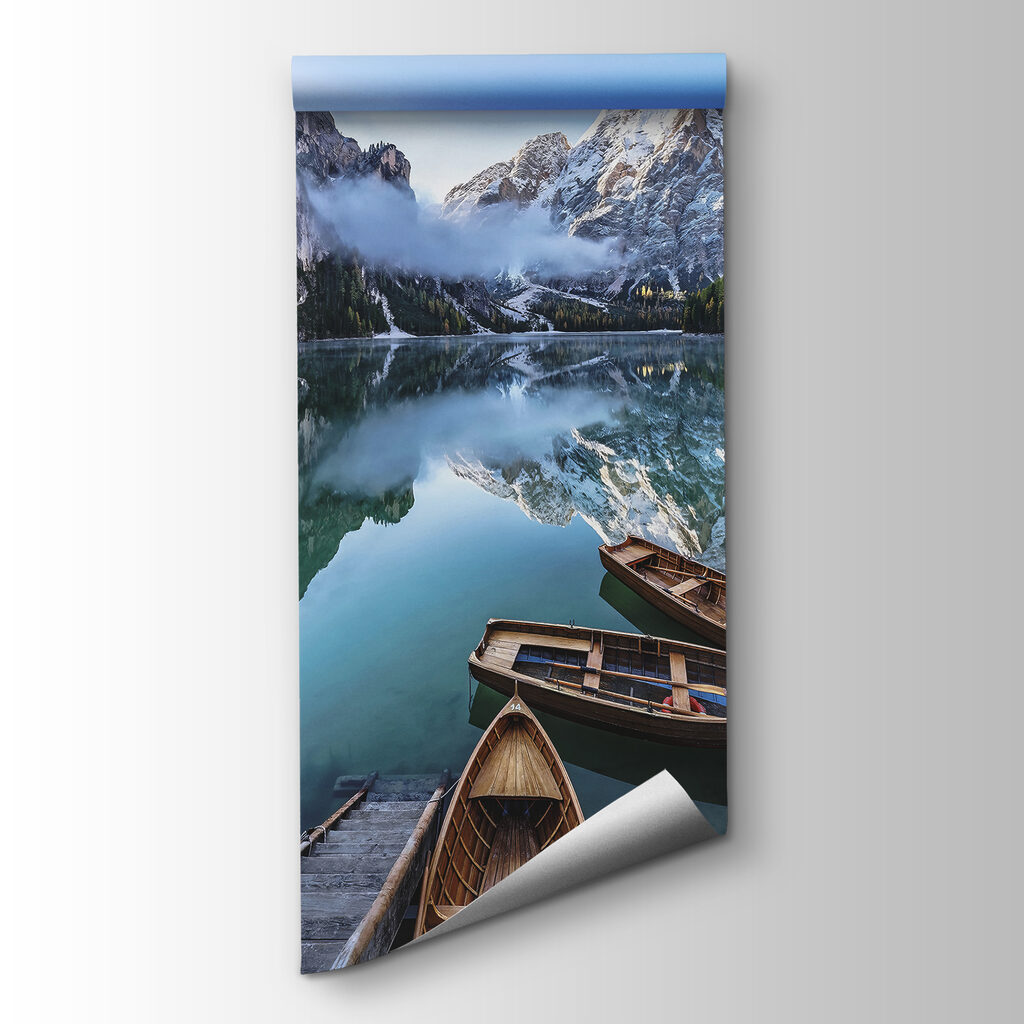 Boats on a lake with mountains in the background
