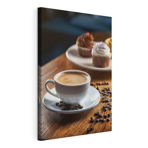 Una taza de café y unos cupcakes sobre una mesa Cuadros Una taza de café y unos cupcakes sobre una mesa