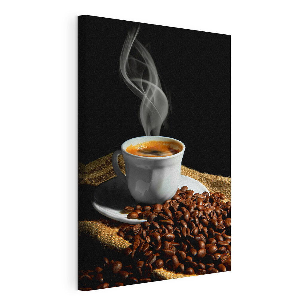 A cup of coffee with smoke on a saucer and beans A cup of coffee with smoke on a saucer and beans