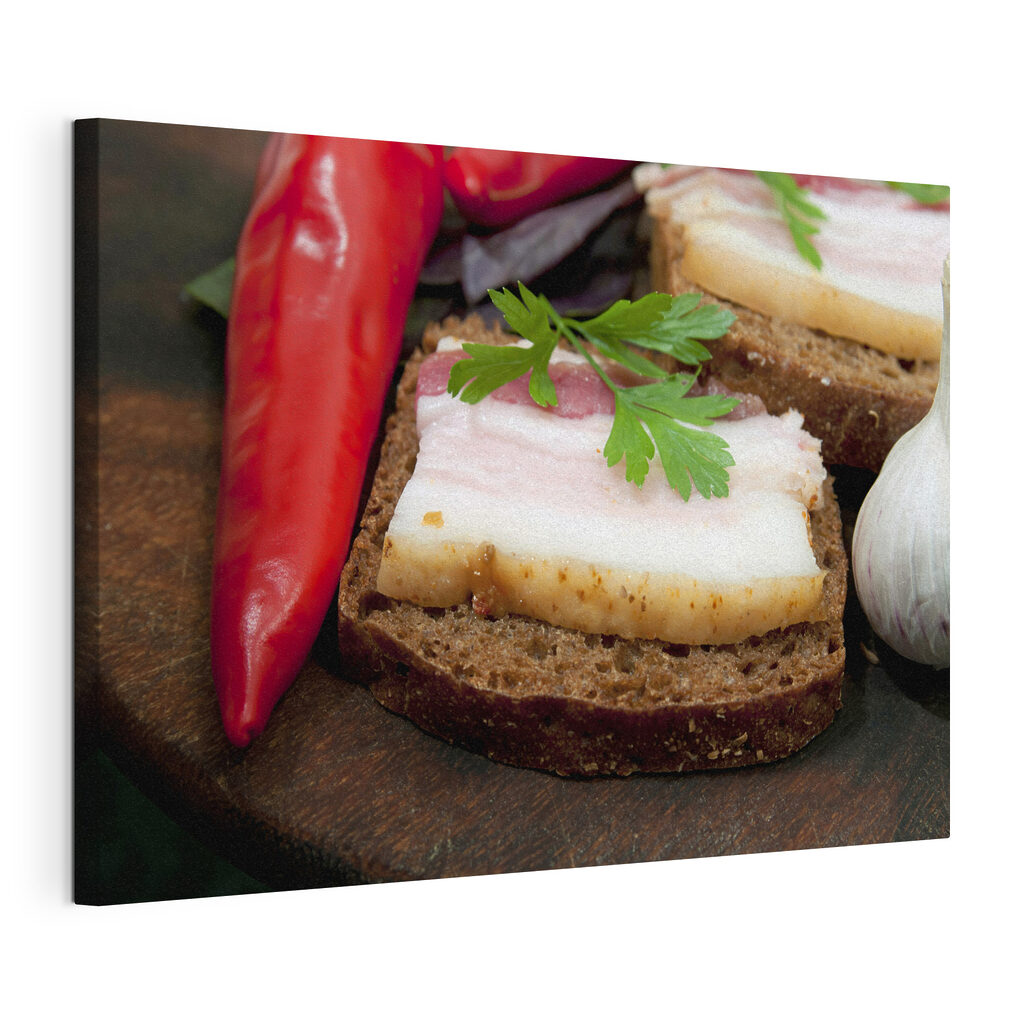 A piece of bread with bacon and parsley on top A piece of bread with bacon and parsley on top