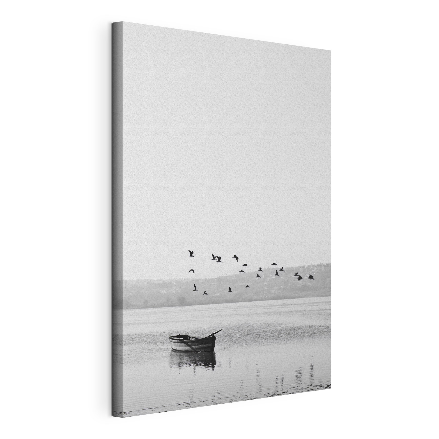 A group of birds flying over a body of water A group of birds flying over a body of water