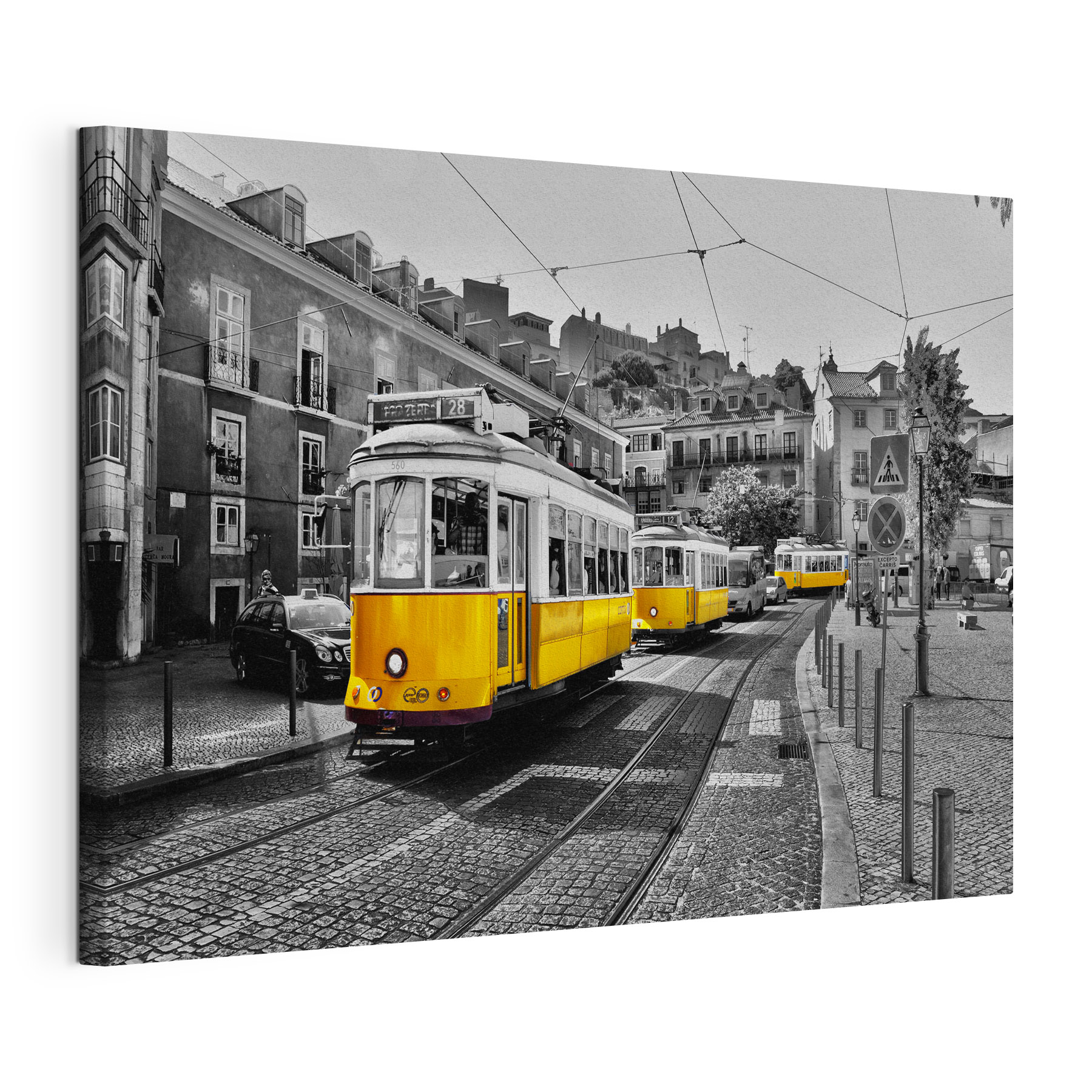 A yellow trolleys on a street A yellow trolleys on a street