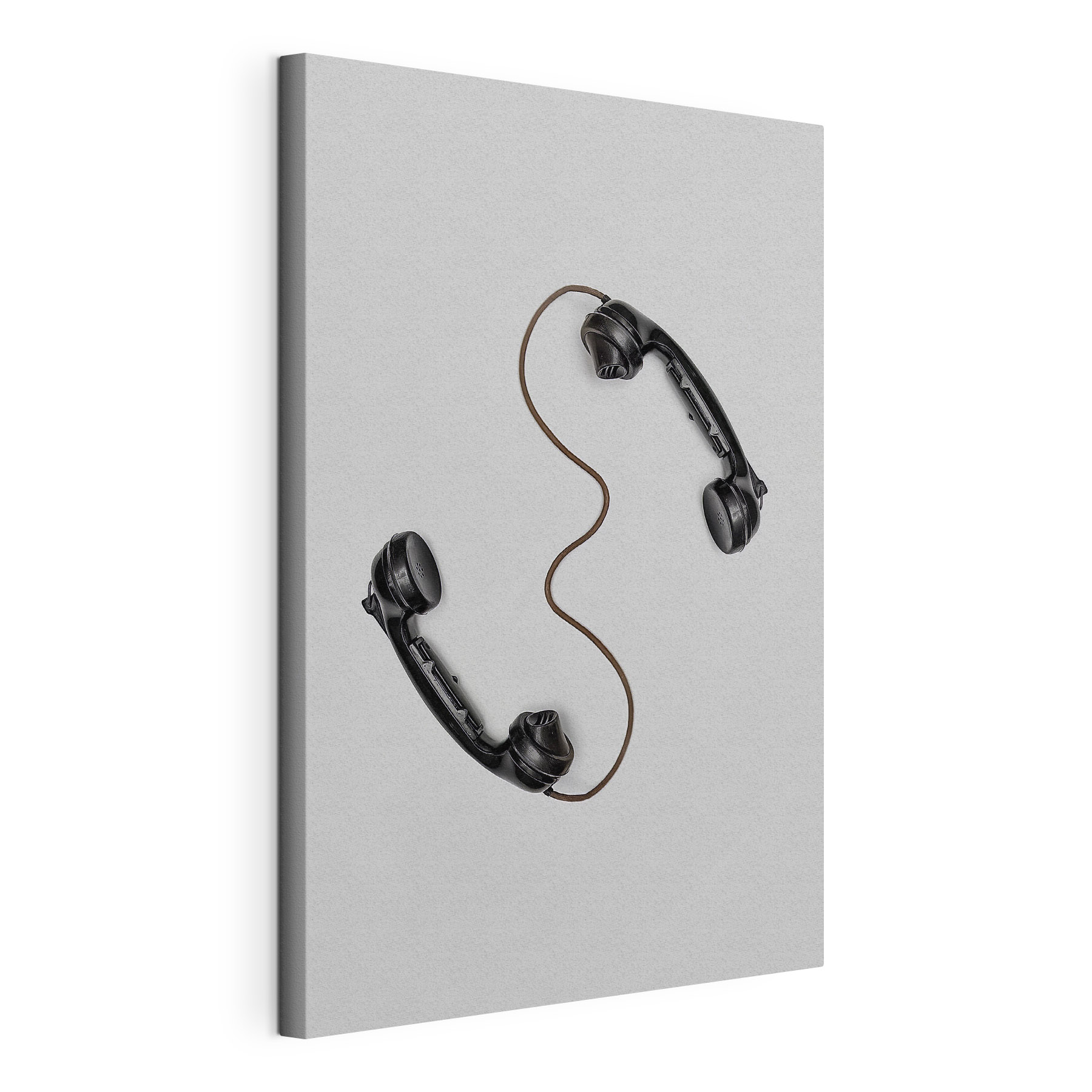 A pair of handsets with a cord A pair of handsets with a cord