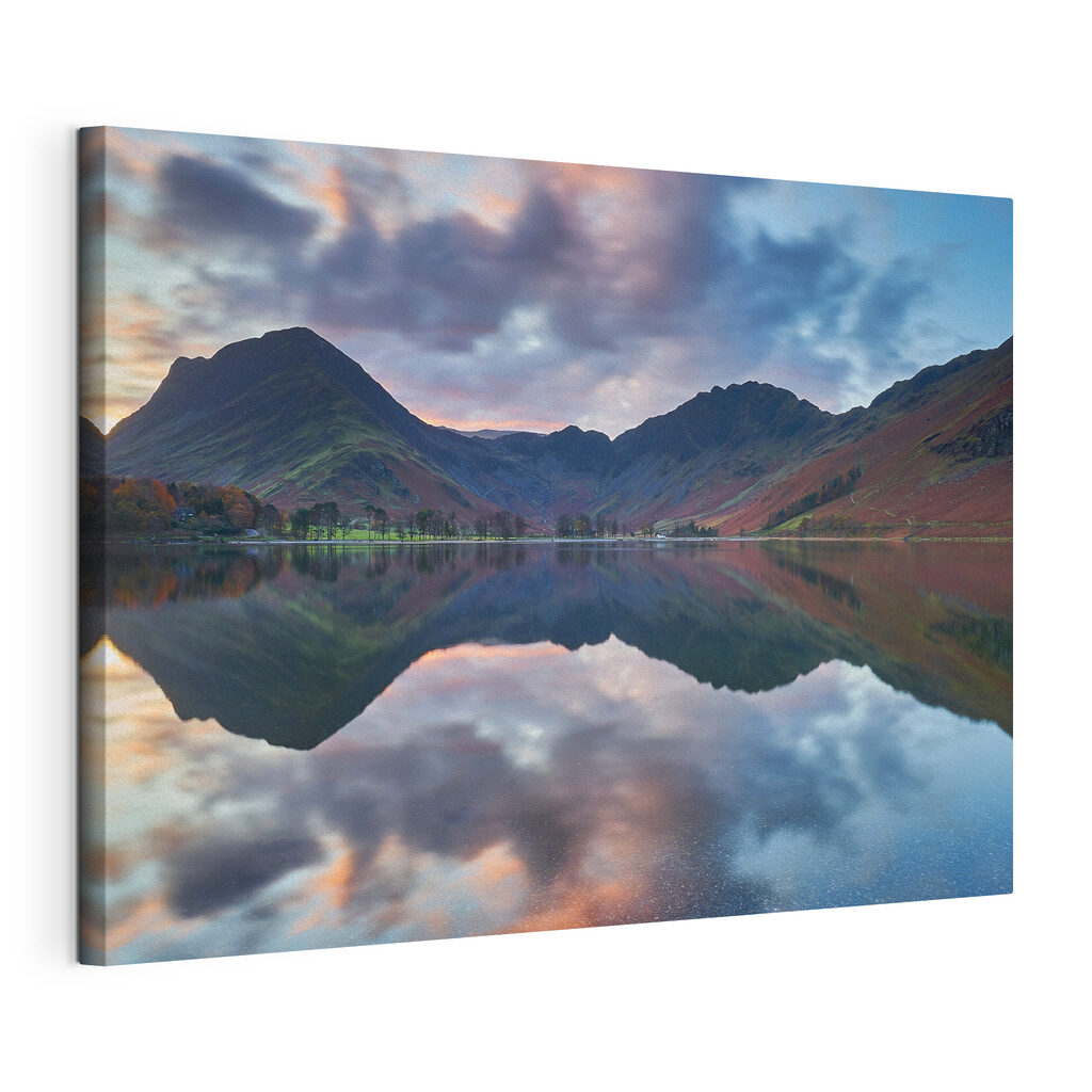 A lake with mountains in the background