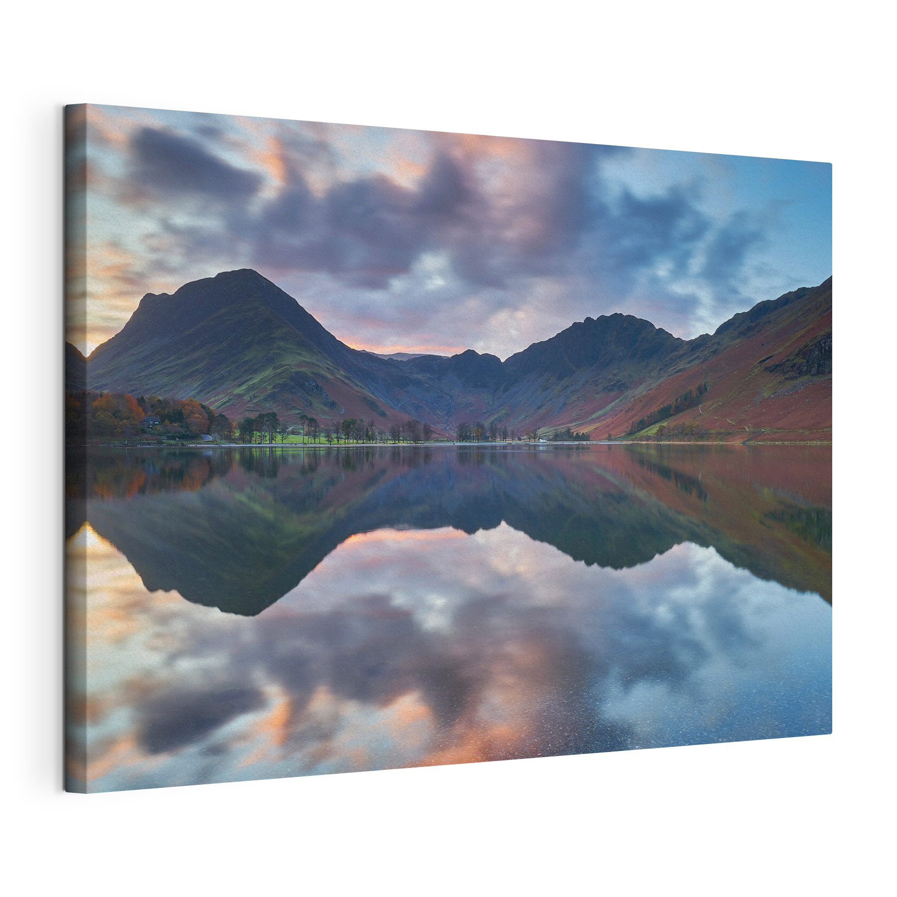 A lake with mountains in the background