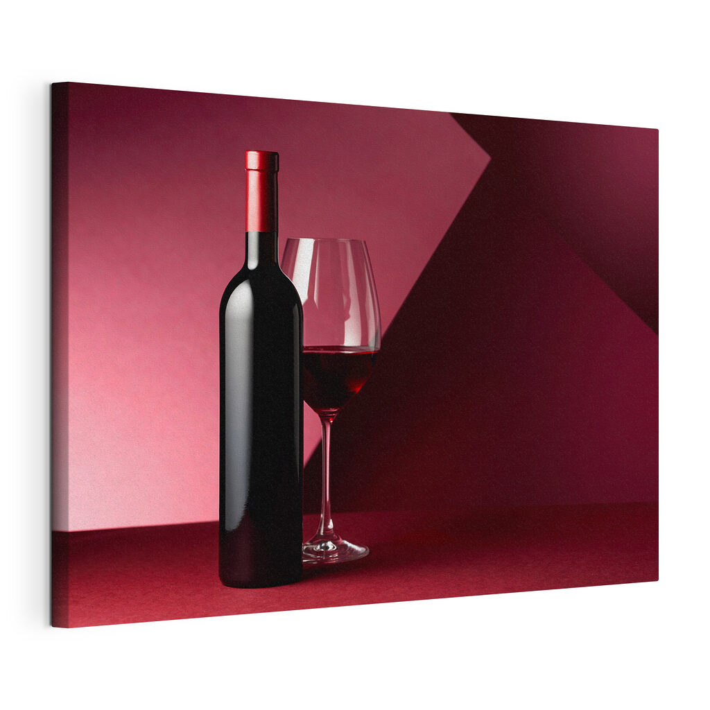 A bottle of wine next to a glass of wine